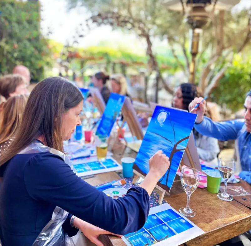 Community members enjoying a guided creative program
