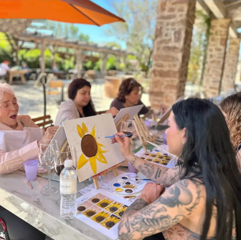 Adults enjoying a guided private painting celebration