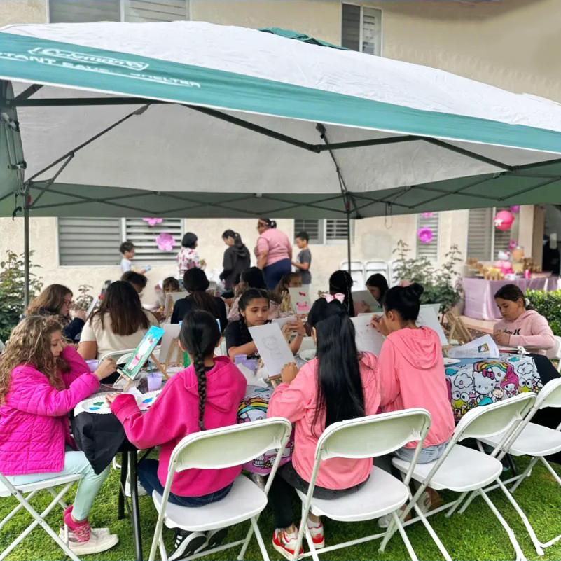 Children participating in an age-appropriate painting activity