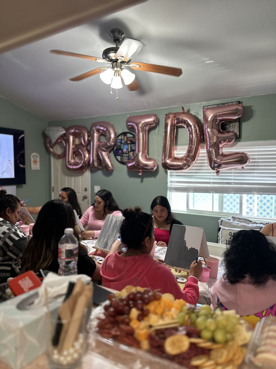 Guests painting together at a bridal shower